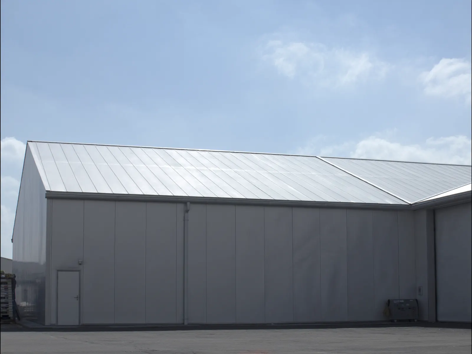 Pre-engineered steel building with a full metal roof and wall system