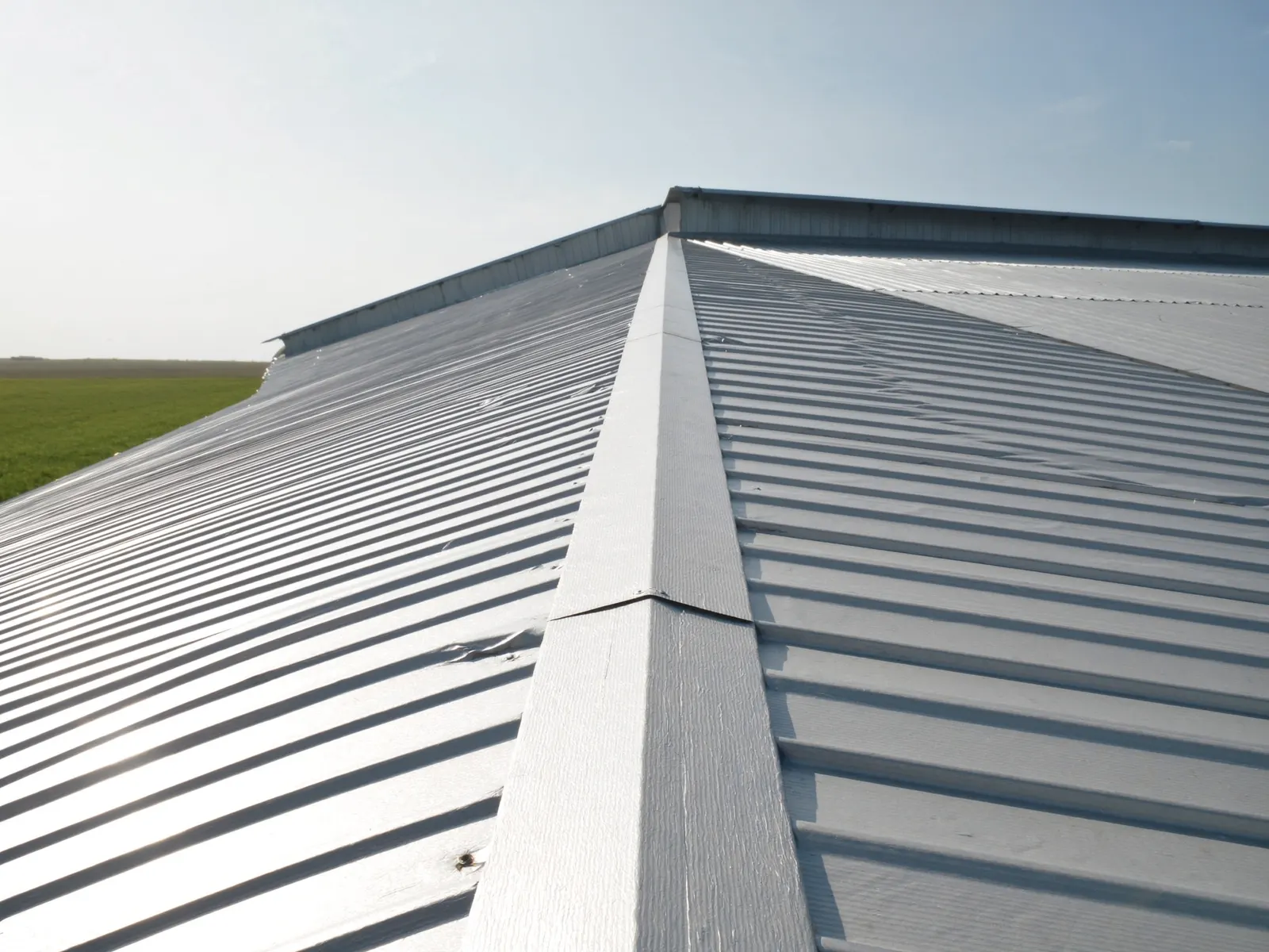 Ribbed R-panel metal roof on a workshop building