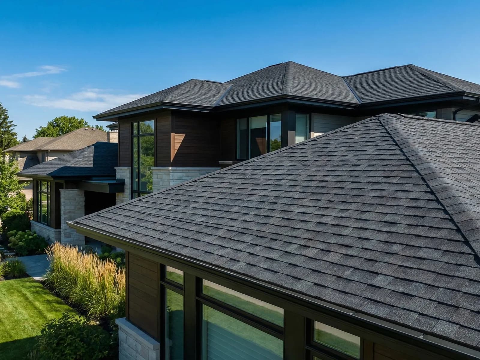 Newly completed architectural shingle roof replacement on a home