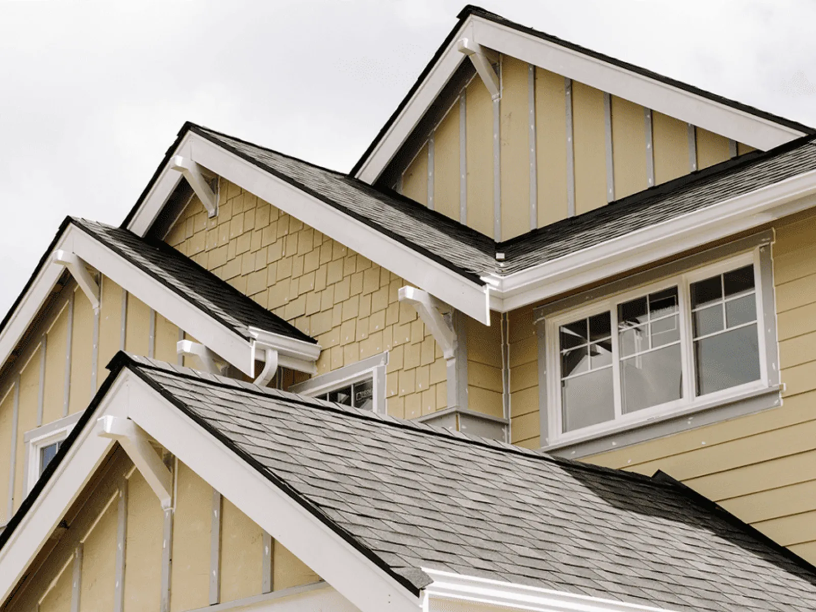 Clean white painted wood fascia along a home's roofline