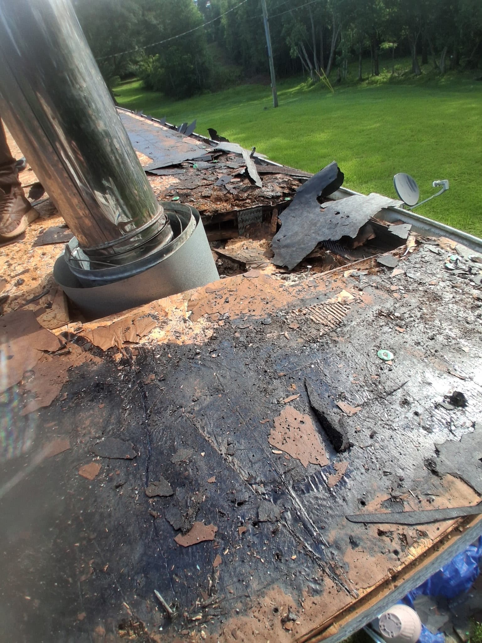 Rotted decking discovered after tear-off documented during a Southeast Roofing inspection in Hattiesburg, Mississippi.