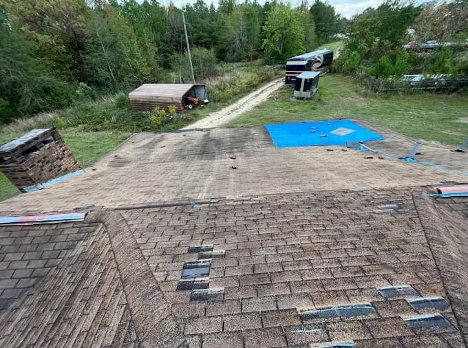 Missing shingles from wind damage documented during a Southeast Roofing inspection in Hattiesburg, Mississippi.