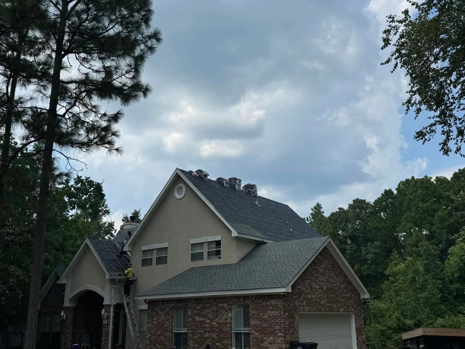 Southeast Roofing crew working on a shingle roof in Hattiesburg, Mississippi