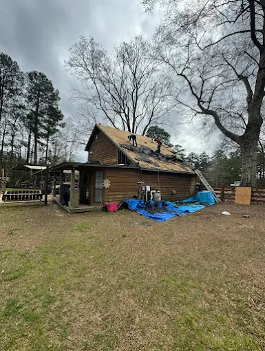 Tear-off down to the decking during a Southeast Roofing roof replacement in Brooklyn, Mississippi.