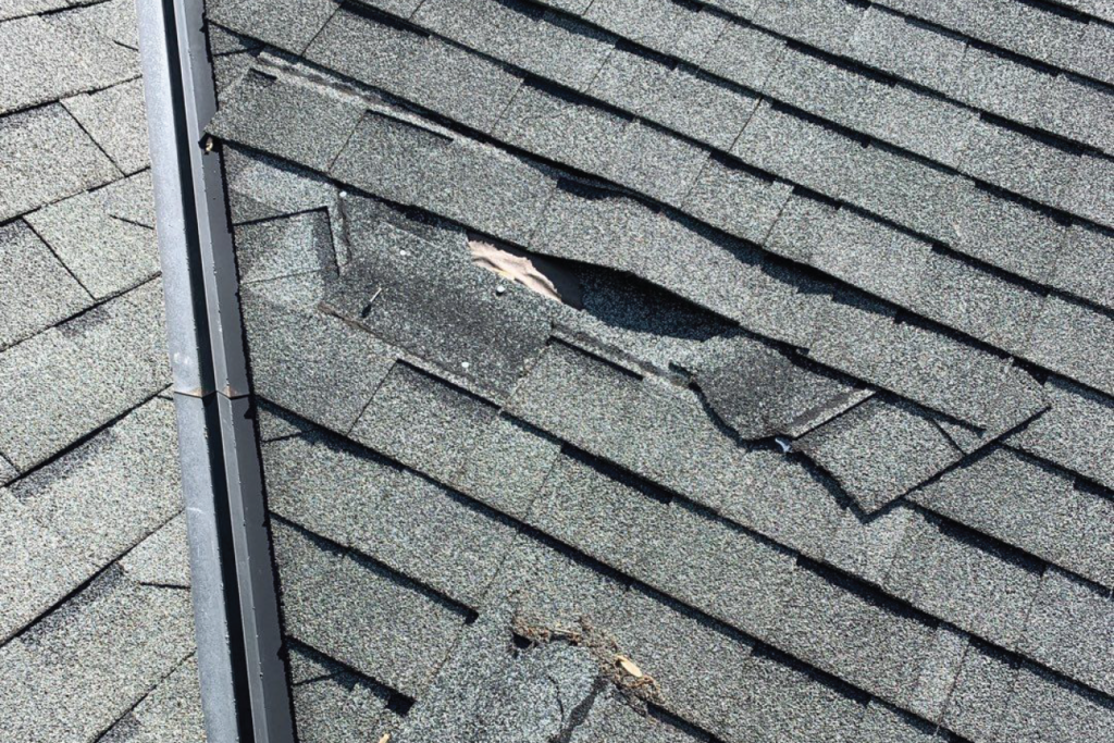 Missing shingles from wind damage documented during a Southeast Roofing inspection in Jackson, Mississippi.